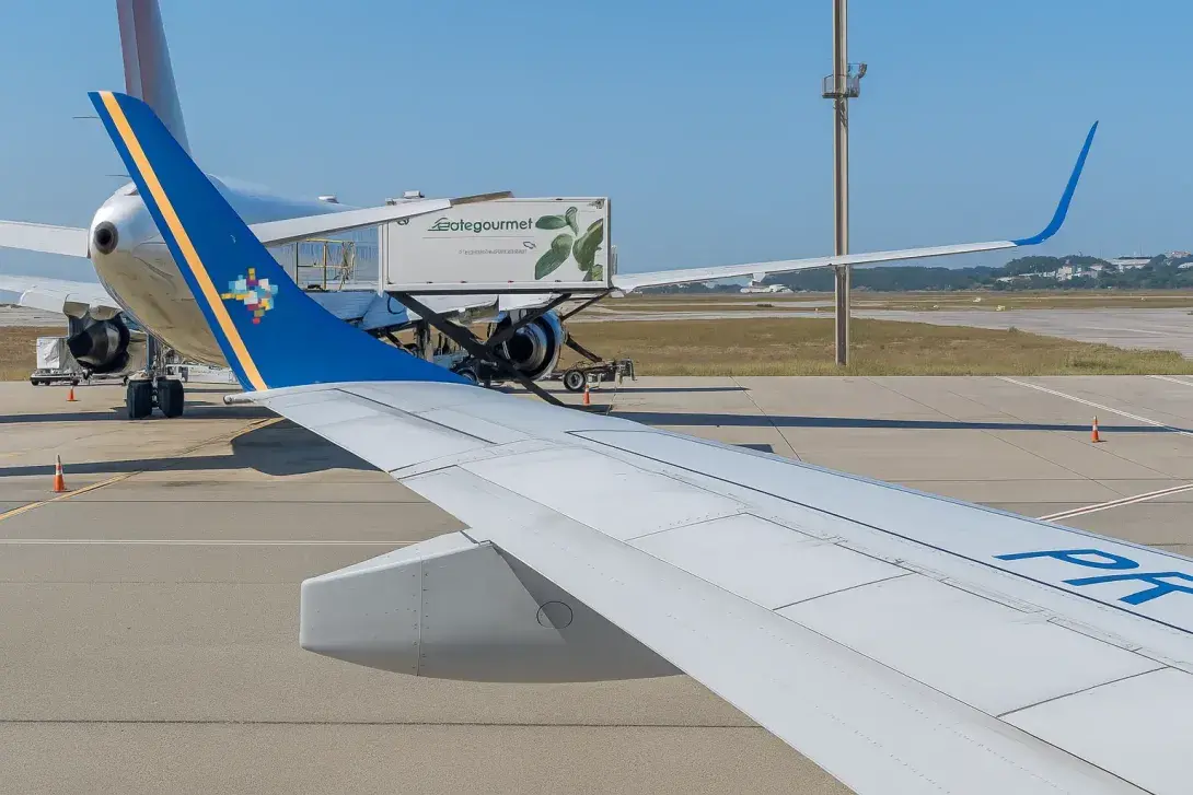 Aircraft from different airlines parked on the apron at Miami International Airport during ground service operations.